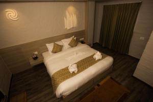 Voodi või voodid majutusasutuse Vastu Boutique Hotel toas