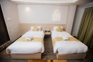 Voodi või voodid majutusasutuse Vastu Boutique Hotel toas