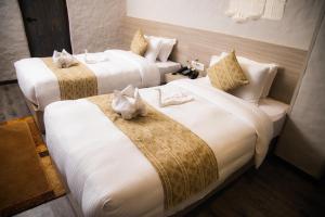 Voodi või voodid majutusasutuse Vastu Boutique Hotel toas