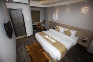 Voodi või voodid majutusasutuse Vastu Boutique Hotel toas