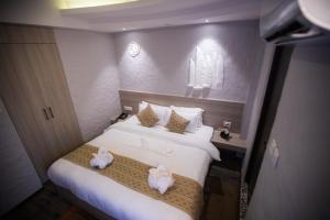 Voodi või voodid majutusasutuse Vastu Boutique Hotel toas