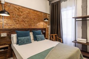 Łóżko lub łóżka w pokoju w obiekcie Waou Boutique SOL