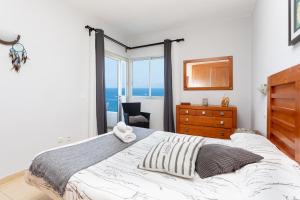 Postel nebo postele na pokoji v ubytování Paradise Beach Suite