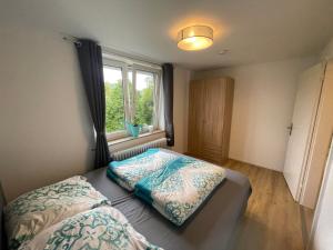 En eller flere senge i et værelse på Fewo Am Park