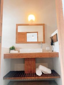a bathroom with a sink and a mirror at Villa Maria Hotel in Valle de Bravo