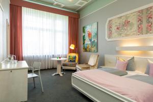 Postel nebo postele na pokoji v ubytování W22 Hotel am Kurfürstendamm