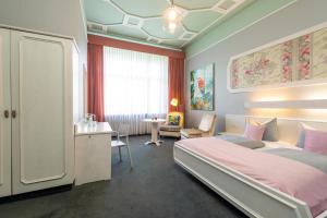 Postel nebo postele na pokoji v ubytování W22 Hotel am Kurfürstendamm