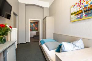 TV a/nebo společenská místnost v ubytování W22 Hotel am Kurfürstendamm