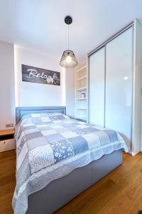 Voodi või voodid majutusasutuse Apartament 26 Willa Ogrodowa toas