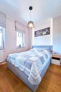 Voodi või voodid majutusasutuse Apartament 26 Willa Ogrodowa toas