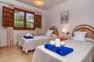 Posteľ alebo postele v izbe v ubytovaní Villa Margarita - A Tranquil Oasis with Large Private Pool