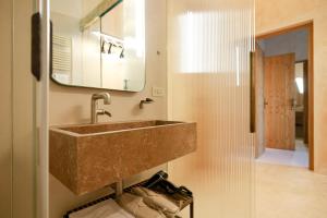 a bathroom with a sink and a mirror at BAYIT Charming Place in Polignano a Mare