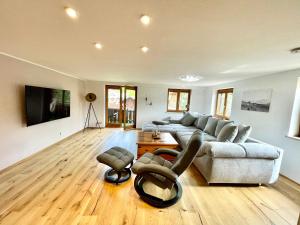 a living room with a couch and a table at Fewo Längerer in Sonthofen