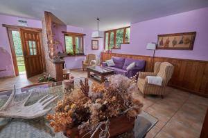 a living room with a couch and a table at La Posada de Cucayo in Dobres