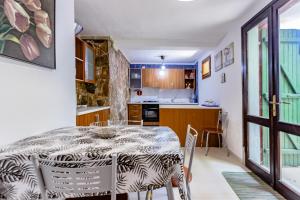 A kitchen or kitchenette at Villa i Ginepri Villasimius località Porto sa ruxi