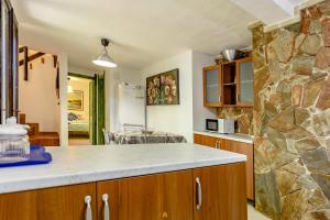 A kitchen or kitchenette at Villa i Ginepri Villasimius località Porto sa ruxi