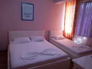 Postel nebo postele na pokoji v ubytování British Hotel