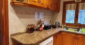 a kitchen with a counter top with utensils on it at Las Bellotas in Moraira