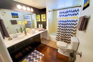 a bathroom with a toilet and a sink and a shower at 4 Mi to Beach Lake Havasu Apartment with Pool! in Lake Havasu City