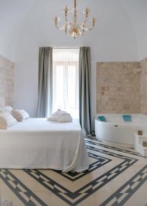 Posteľ alebo postele v izbe v ubytovaní Villa Aurelia Suites and Apartments