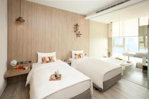 Voodi või voodid majutusasutuse Hotel Day Plus Teascape toas