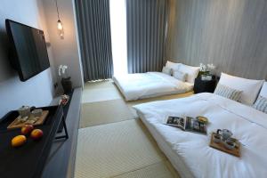 Voodi või voodid majutusasutuse Hotel Day Plus Teascape toas