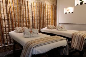 Postel nebo postele na pokoji v ubytování Hotel Bogota Expocomfort - Embajada Americana
