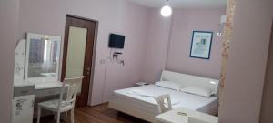 Postel nebo postele na pokoji v ubytování British Hotel