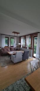 a living room with a couch and a table at 1060 Meet Eat Hike & Tour in Plav +25 photos