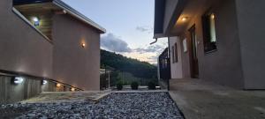 a hallway of a house with a view of a mountain at 1060 Meet Eat Hike & Tour in Plav