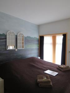 Cama o camas de una habitación en B&B Sagenland