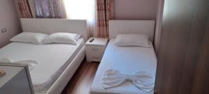 Postel nebo postele na pokoji v ubytování British Hotel