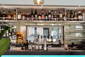 a bar with a lot of bottles of alcohol at Hotel Restaurant Anno Nu in Oostkapelle