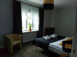 Een bed of bedden in een kamer bij Apartament Konopnicka