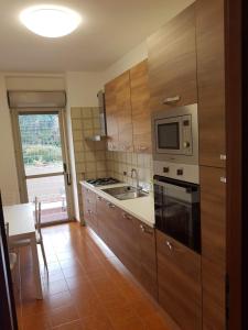 A kitchen or kitchenette at Casa Stazione Magliana