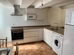 Una cocina o zona de cocina en Casa Santa Maria I con barbacoa