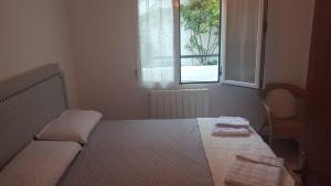 Cama o camas de una habitación en Casa Santa Maria I con barbacoa
