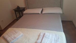 Cama o camas de una habitación en Casa Santa Maria I con barbacoa