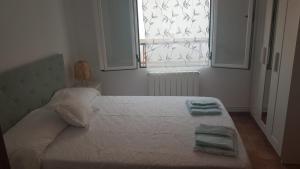 Cama o camas de una habitación en Casa Santa Maria I con barbacoa