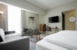 Un televizor și/sau centru de divertisment la Nordic Hotel Lagos