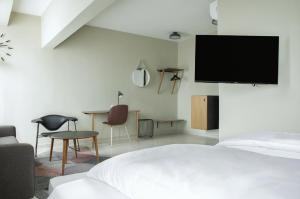 Un televizor și/sau centru de divertisment la Nordic Hotel Lagos