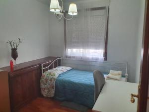 Posteľ alebo postele v izbe v ubytovaní APT para Amigos y Familias