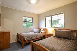 Postel nebo postele na pokoji v ubytování Kaka Retreat Motel, Stewart Island
