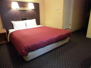 Cama o camas de una habitación en Sapporo Classe Hotel