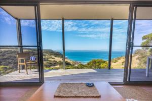 a living room with a view of the ocean at Sea Dragon Kangaroo Island in Penneshaw