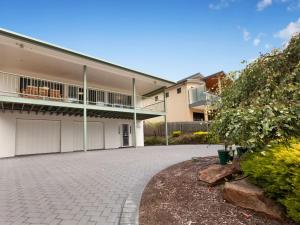 an empty driveway in front of a house at Dromana Bay Views Dromana in Dromana