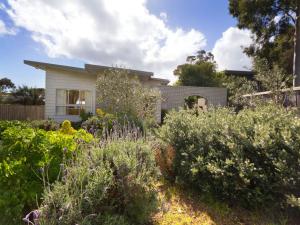 a garden in front of a house at Home Sweet Home Mount Martha in Mount Martha