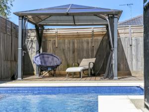 a gazebo next to a swimming pool at Sweetlands Sanctuary in Mount Martha