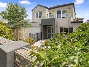 a house with plants in front of it at Bangalow Mornington in Mornington