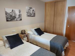 A bed or beds in a room at Ultreia